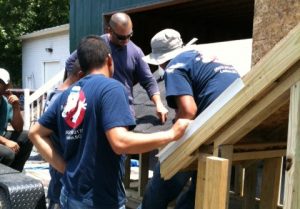 A Tri County Roofing crew loading up materials for a job.