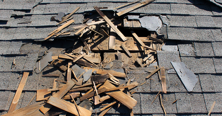 A Damaged roof before repair by Trico Exteriors